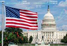 An American flag flying in front of the U.S. Capitol building with financial stock charts overlaid.